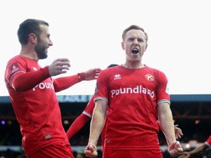 Walsall's Danny Johnson celebrates scoring their side's first goal of the game during the Emirates FA Cup third round match at Edgeley Park, Stockport