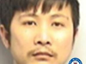 Doan Van Nguyen is wanted oon recall to prison in relation to cultivating cannabis. Photo: West Midlands Police