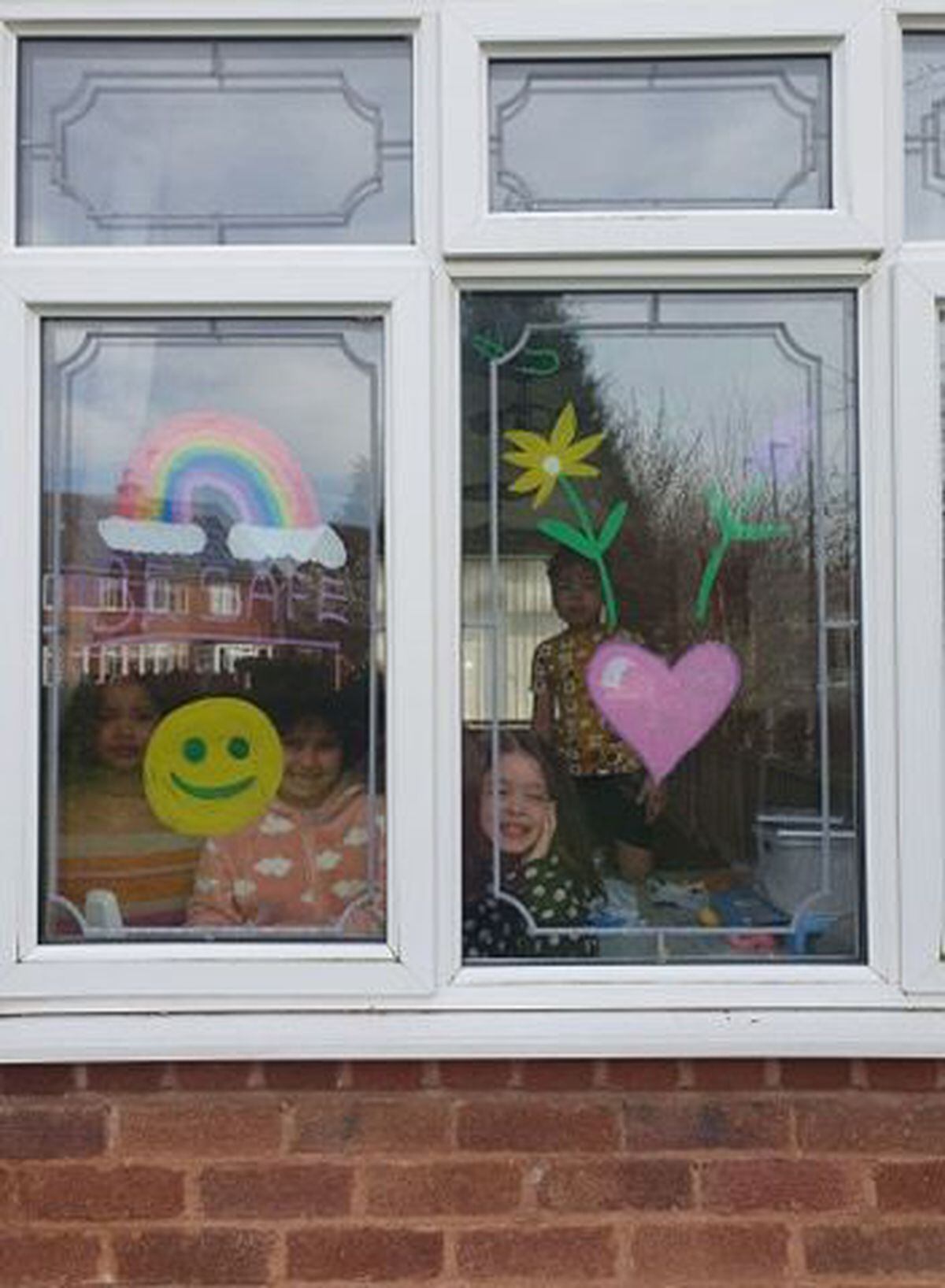 Ava, Maycee Cheyenne and Izaak with their rainbows in Northycote, Wolverhampton