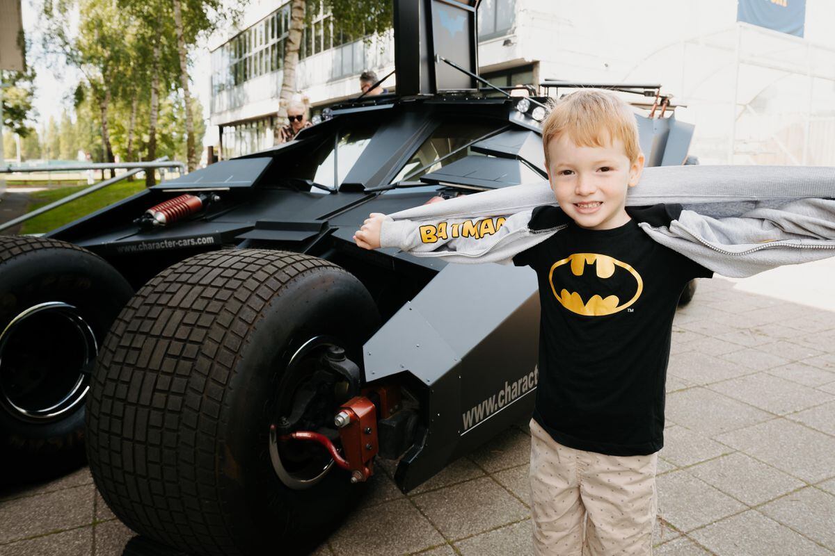 Theodore Abley-Yapp, aged six, from Sutton Coldfield with the Dark Knight's bat mobile