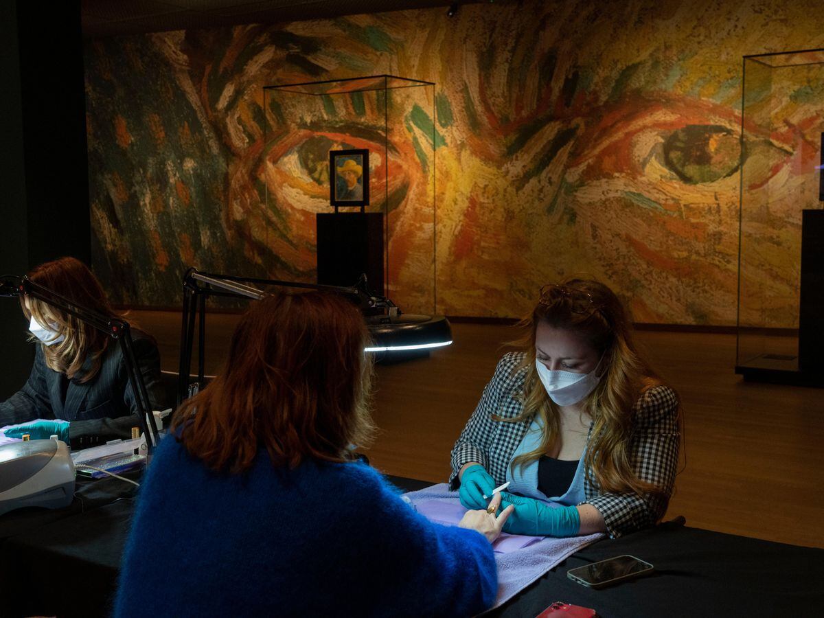 A woman gets a manicure at the Van Gogh museum (Peter Dejong/AP)
