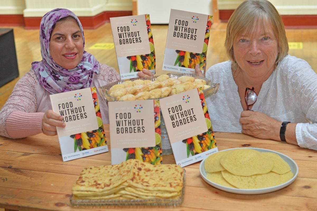 Gill Kelly, from Wolverhampton City of Sanctuary has produced a cookbook called "Food without borders", which she collected from migrants and asylum seekers working with the sanctuary and in association with the Refugee and Migrant centre. She is pictured with Hamia Boutarik who contributed to the book
