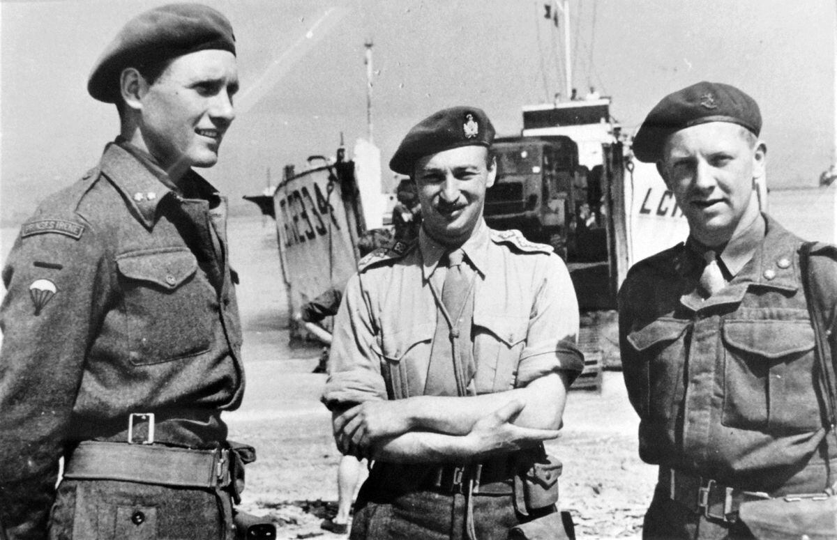 Robbert Fack, left, the liaison-officer with the British Army, and another member of the Princess Irene Brigade on a Normandy beach in late July 1944.