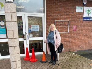 Councillor Tina Jukes outside the damaged Frank F Harrison Community Association doors in Stephenson Square, Beechdale, Walsall