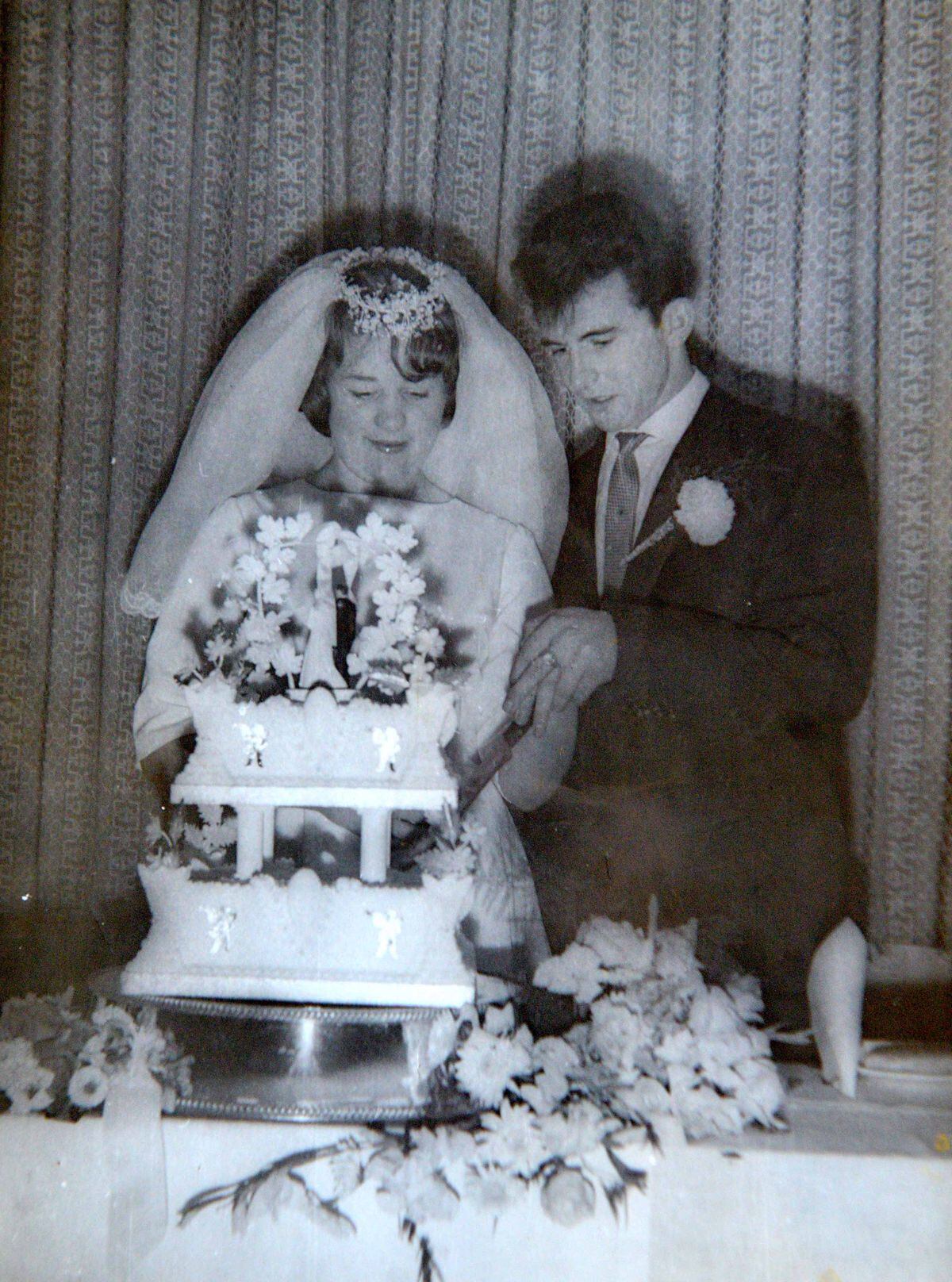 Margaret and Bernard cut the cake on their wedding day, September 9 1962