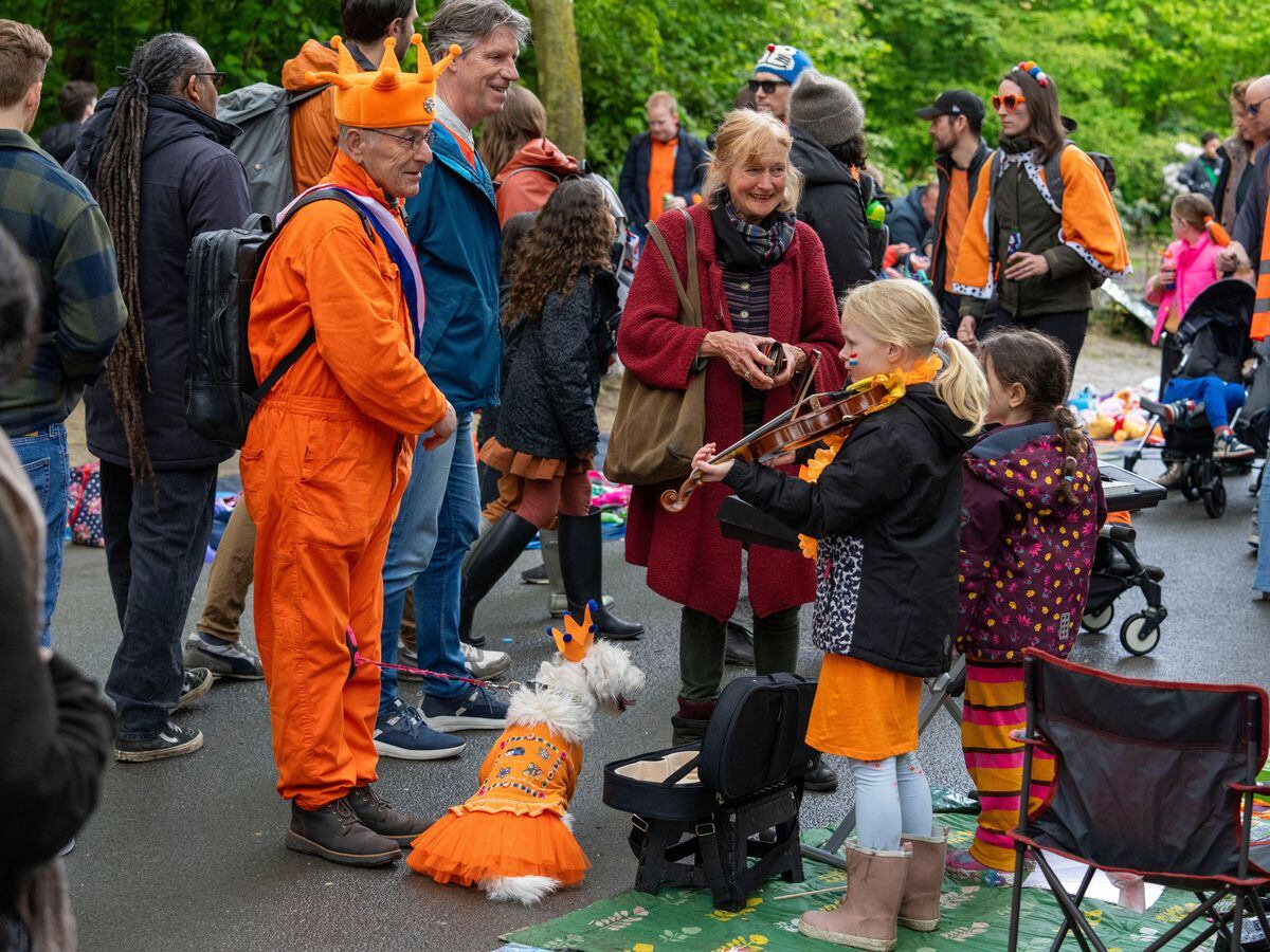Revellers dress in orange to celebrate Dutch king’s birthday | Express ...