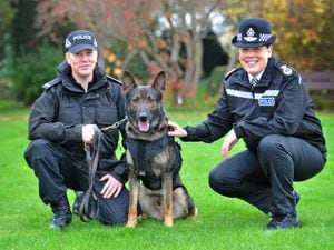 PC Dan Hines and West Mercia Police's Chief Constable Pippa Mills with Police Dog Alvin, who is wearing one of the force's new protective vests.