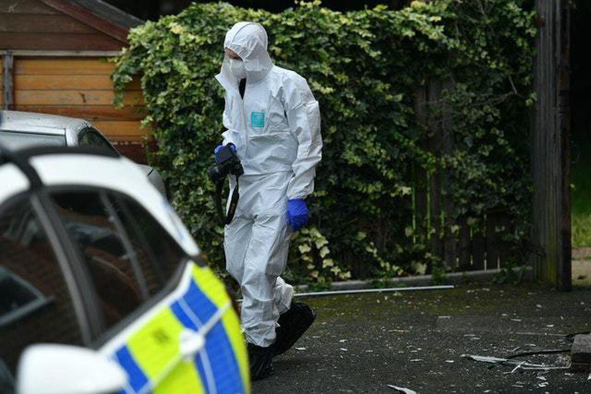 A forensics investigator outside a property in Selly Oak, Birmingham