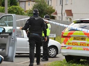 Police at the scene of the incident on Hodnet Drive in Pensnett. The man was eventually arrested after 23 hours of a stand-off