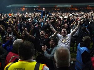 Port Vale fans invading the pttch after making it to the League Two play-off final (PA)