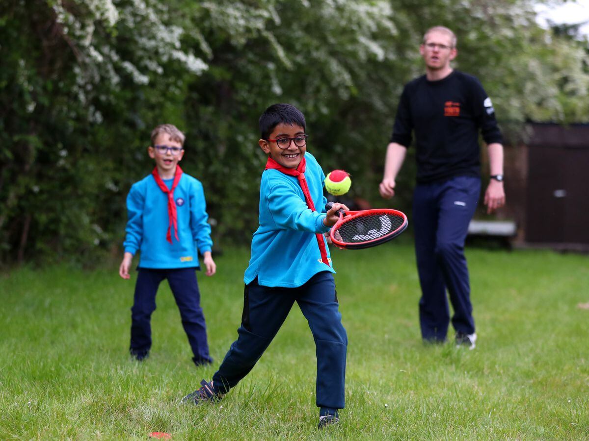 A Beavers group takes part in a tennis activity
