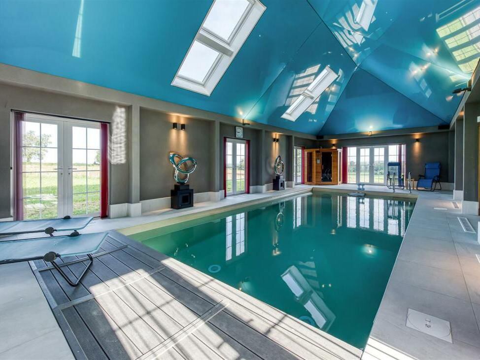 Inside sprawling farmhouse with indoor pool after price is slashed to just £1.5 million