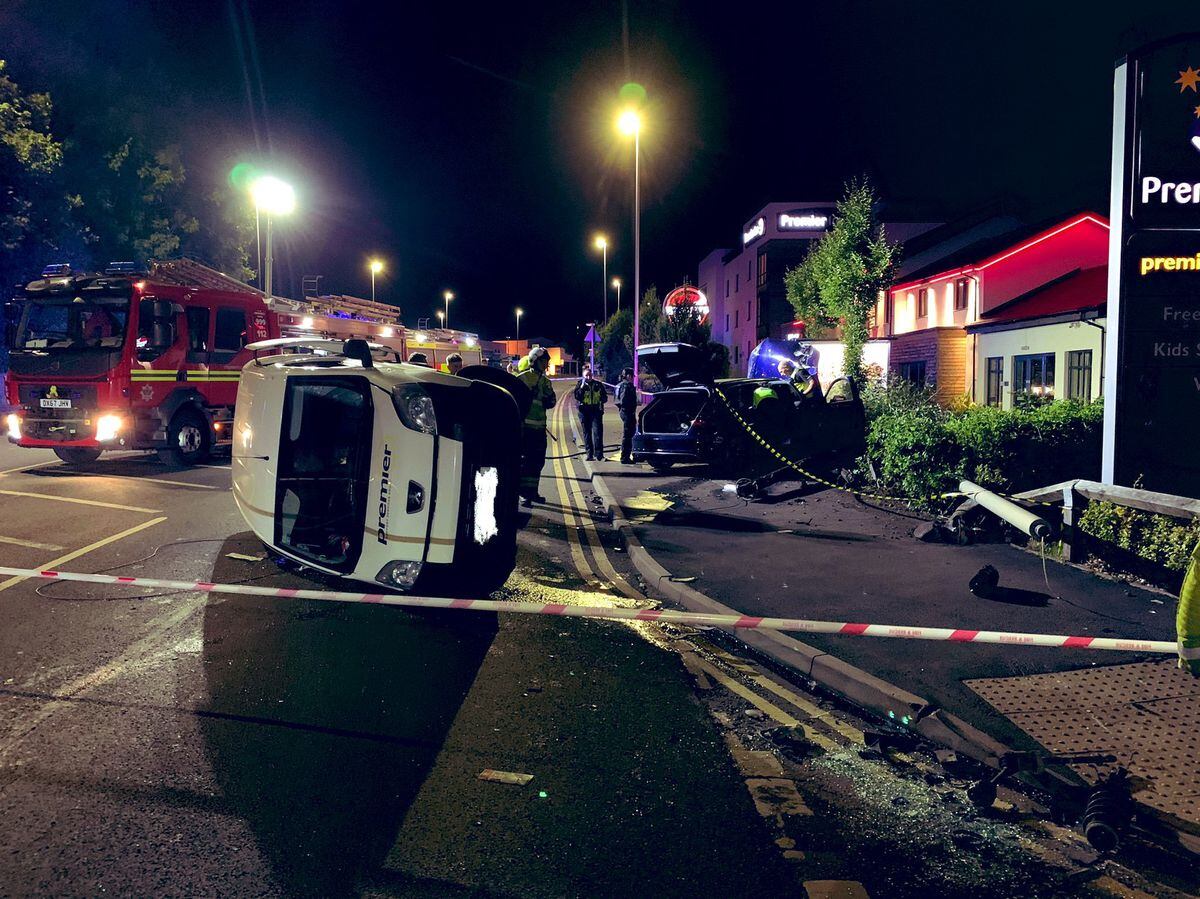 The van ended up on its side after colliding with a car outside Premier Inn in Stourbridge. Photo: @WMFSStourbridge