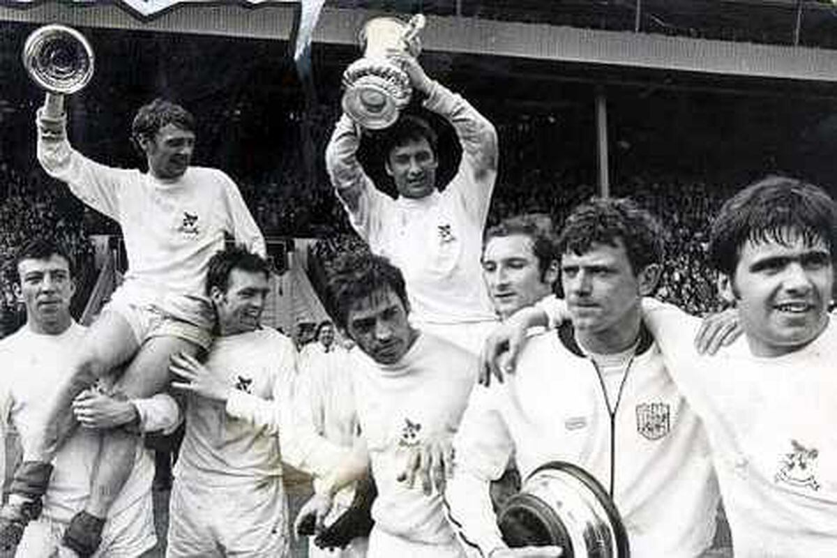 Clive Clark holds the FA Cup lid after Albion's win at Wembley in 1968
