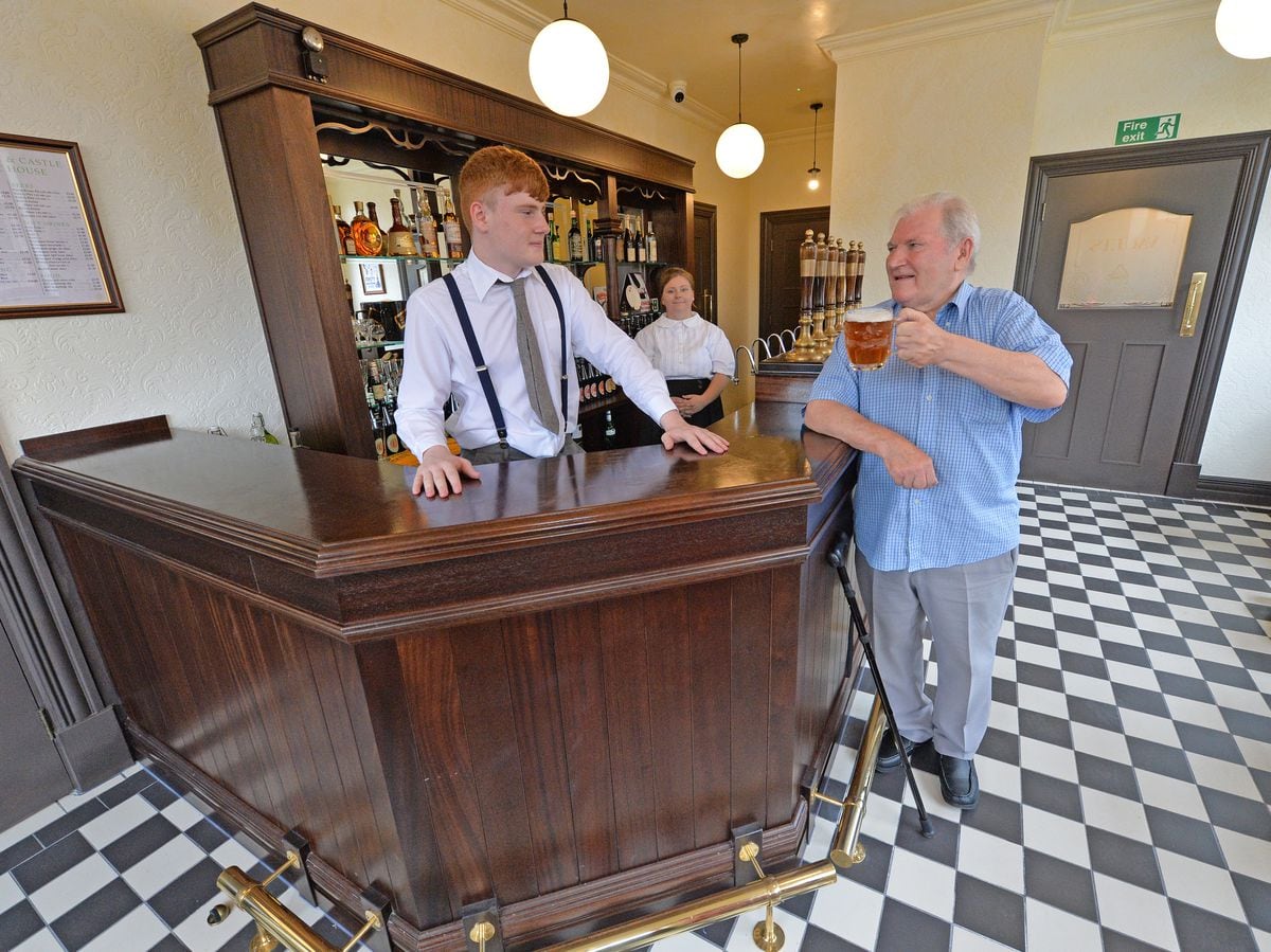 John Purchase raises a glass in the refurbished bar. He had the honour of pulling the first pint