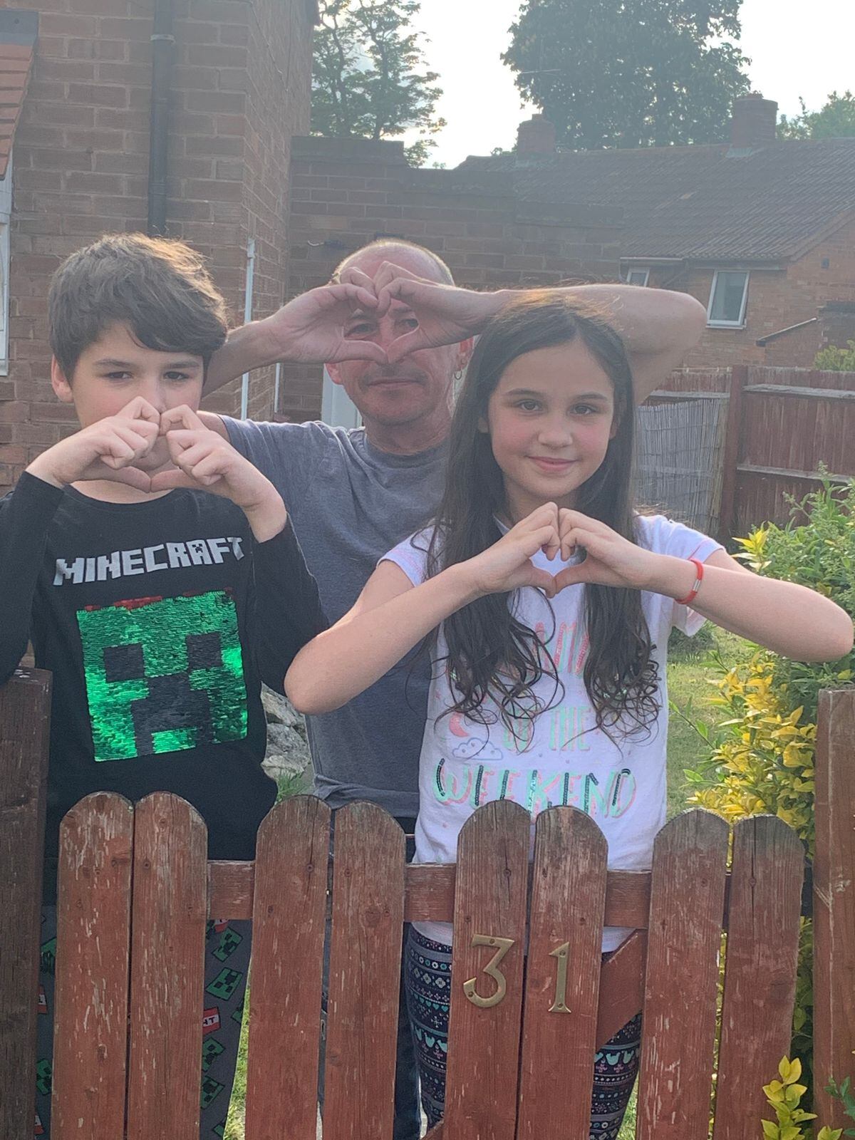 Dave Sharples with his children make a heart for Bridgnorth