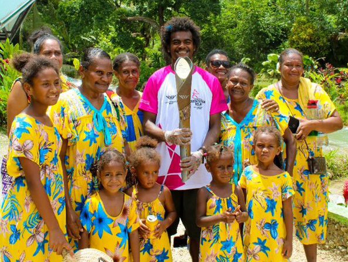 A Batonbearer with the Baton and local people in Vanuatu