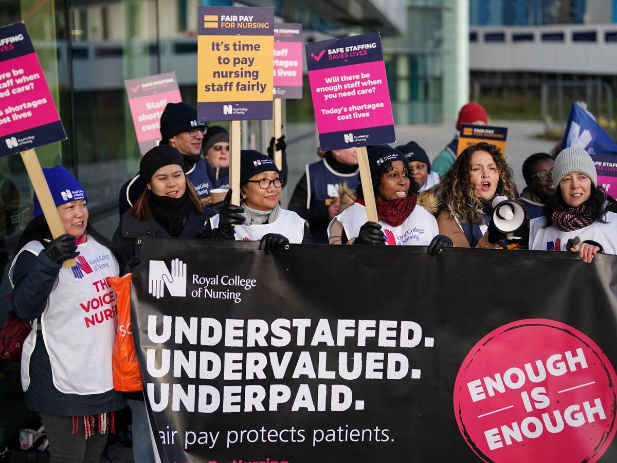 Workers on the picket line outside Queen Elizabeth hospital in Birmingham during a strike by nurses and ambulance staff. Photo: Jacob King/PA Wire.            