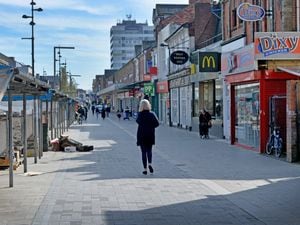Sparse West Bromwich High Street which mirrored many towns and cities in the West Midlands today amid new strict Government advice