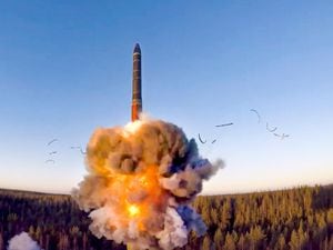 A rocket launches from missile system as part of a ground-based intercontinental ballistic missile test launched from the Plesetsk facility in north-west Russia (Russian Defense Ministry Press Service/AP)
