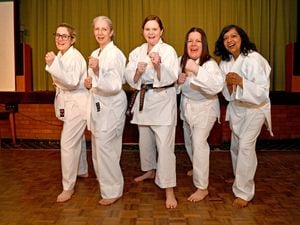 Jane Garratt (centre) has opened her own karate club