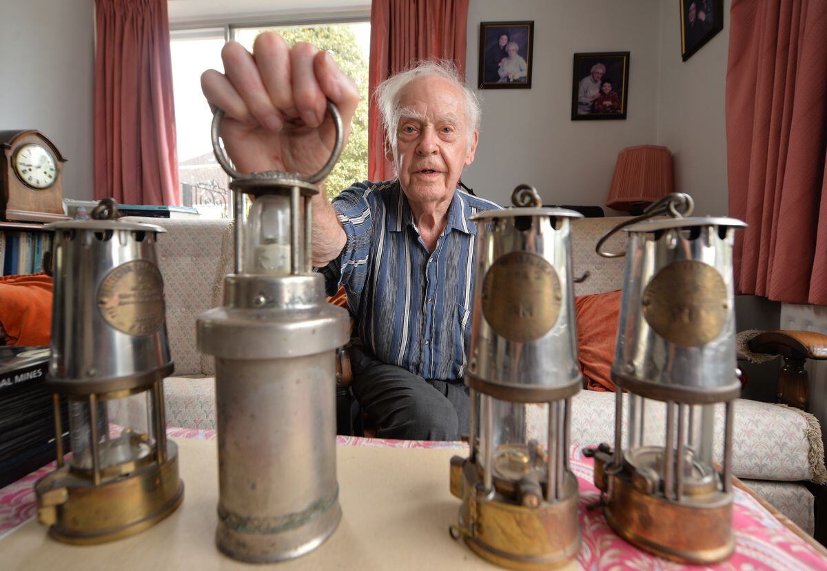 Retired assistant manager at Littleton Collery, Trevor Matthews, of Claverley, with his mining lamps
