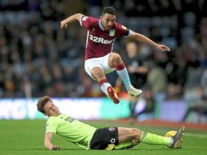 Neil Taylor in action for Villa