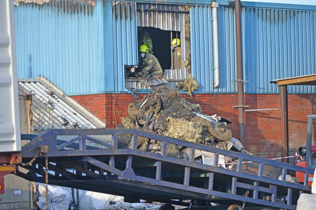 West Midlands Fire Service said crews were fighting the fire "from within"