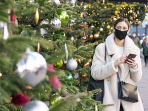 Christmas shopper in face mask
