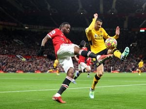  Aaron Wan-Bissaka of Manchester United has his clearance blocked by Romain Saiss (Getty Images)