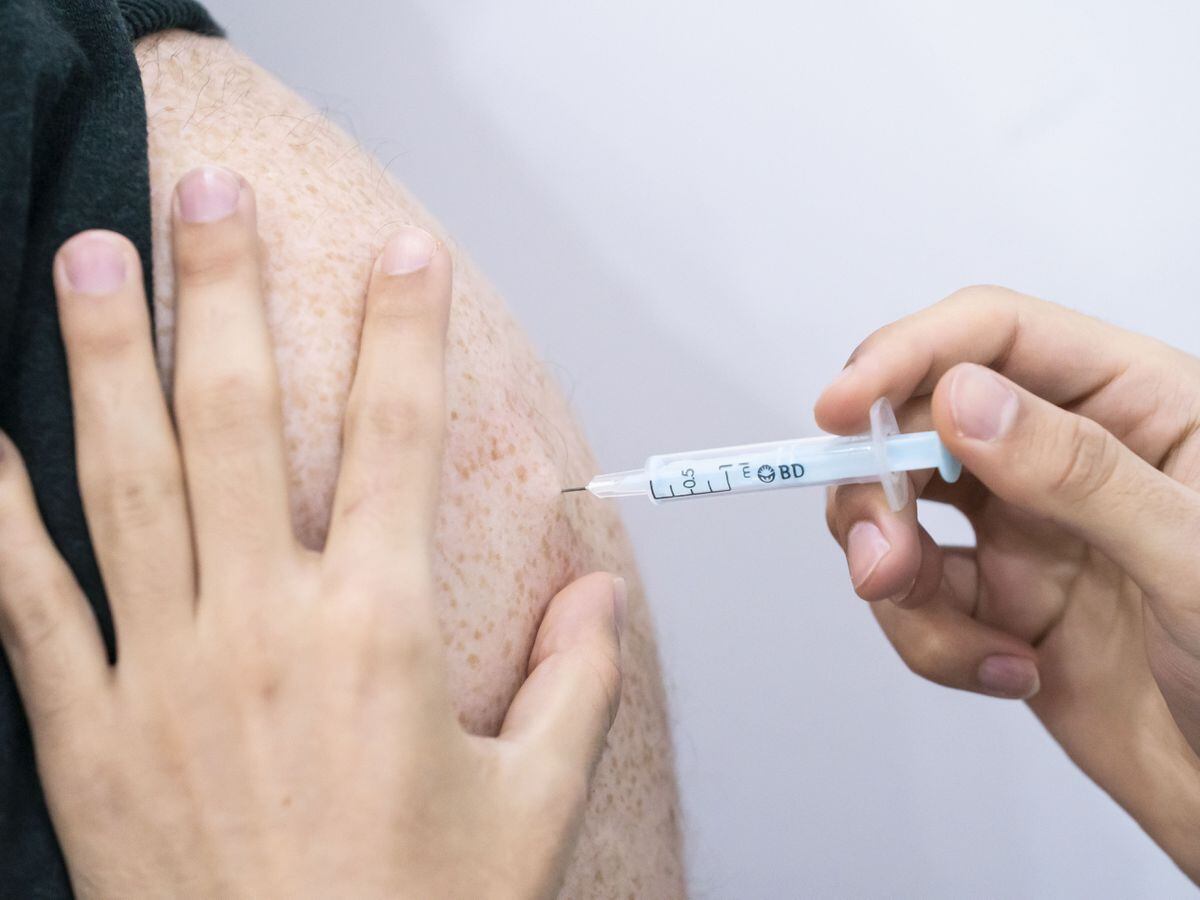 A booster coronavirus vaccine is administered at a Covid vaccination centre at Elland Road in Leeds, as the booster vaccination programme continues across the UK (Danny Lawson/PA)
