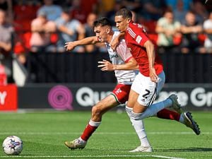 Walsall’s Oisin McEntee battles for possession with Salford City’s Ethan Ingram during Saturday’s 2-1 victory