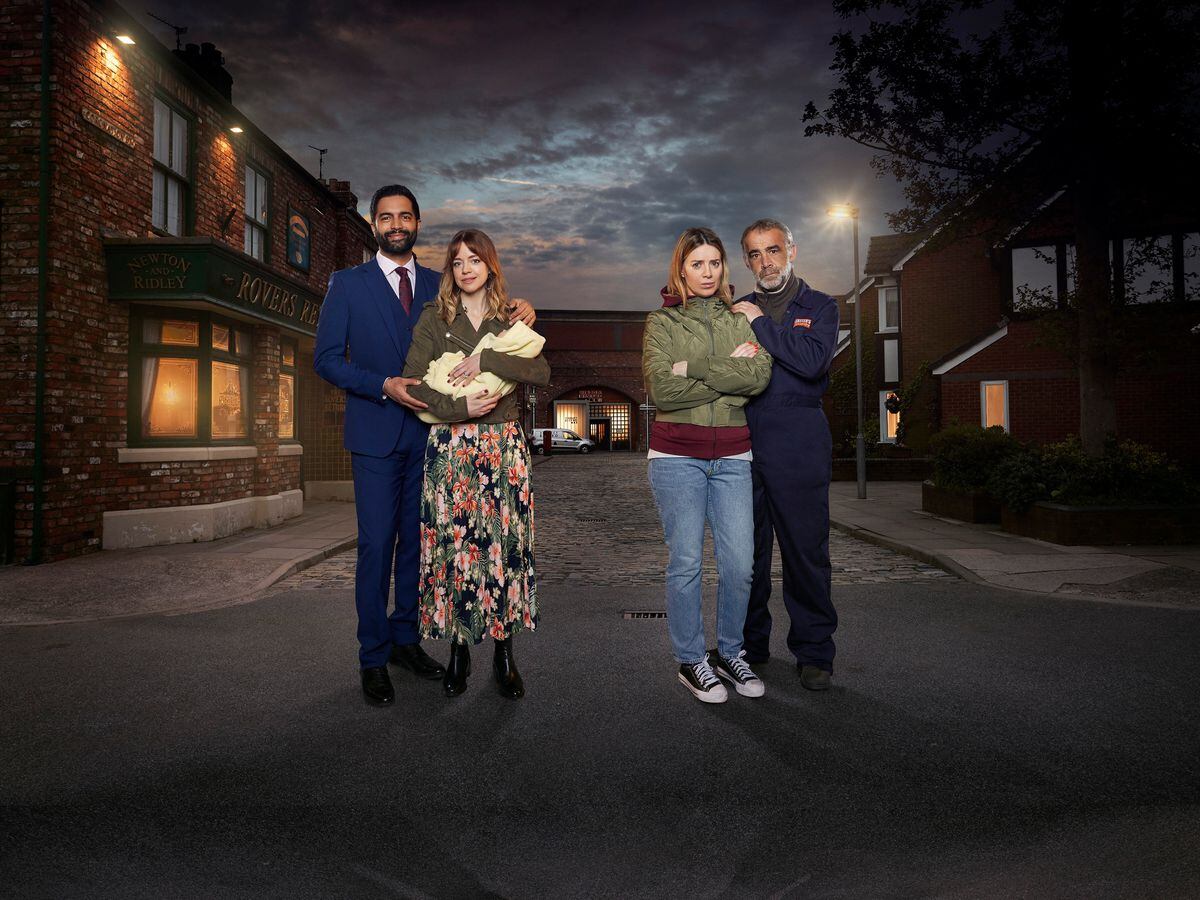 Imran, Toyah, baby Alfie, Abi and Kevin in the Street on a eerie night