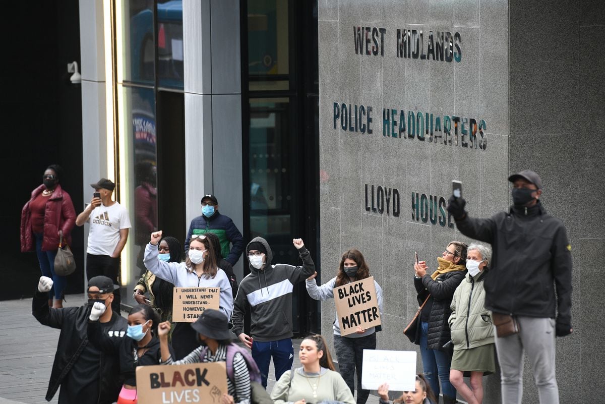People gathered outside the home of West Midlands Police to stage a peaceful rally on Thursday