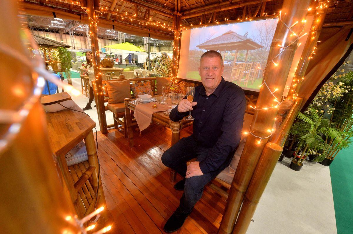 Glen Spencer from Bamboo Connections inside a luxury garden seating area