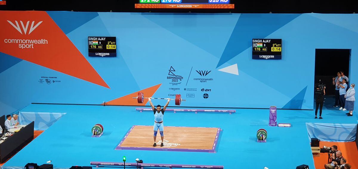 Ajay Singh from India produces a successful lift in the weightlifting