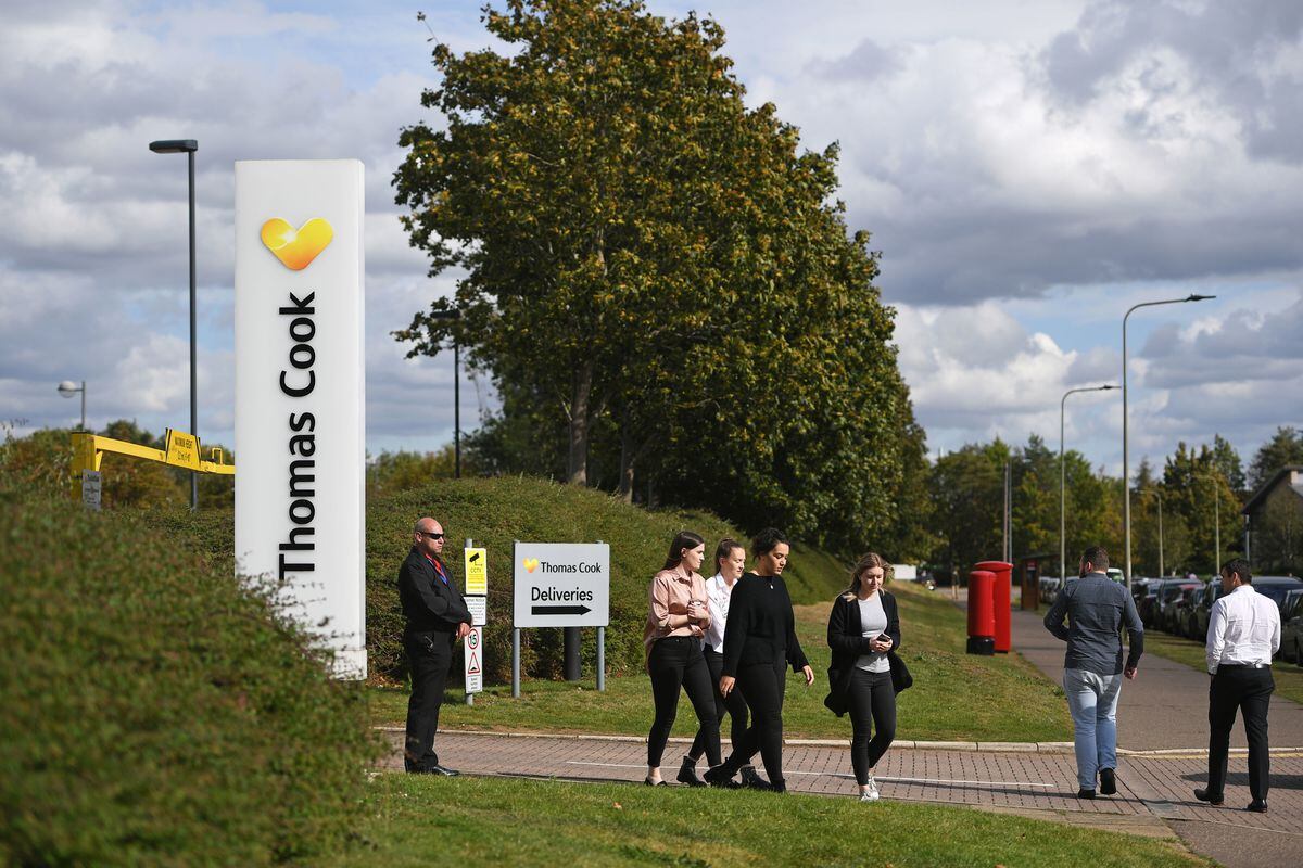 People outside the Peterborough headquarters of Thomas Cook on Monday