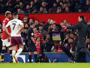 Referee Michael Oliver consults VAR to decide on Aston Villa's Danny Ings' goal during the Emirates FA Cup third round match at Old Trafford