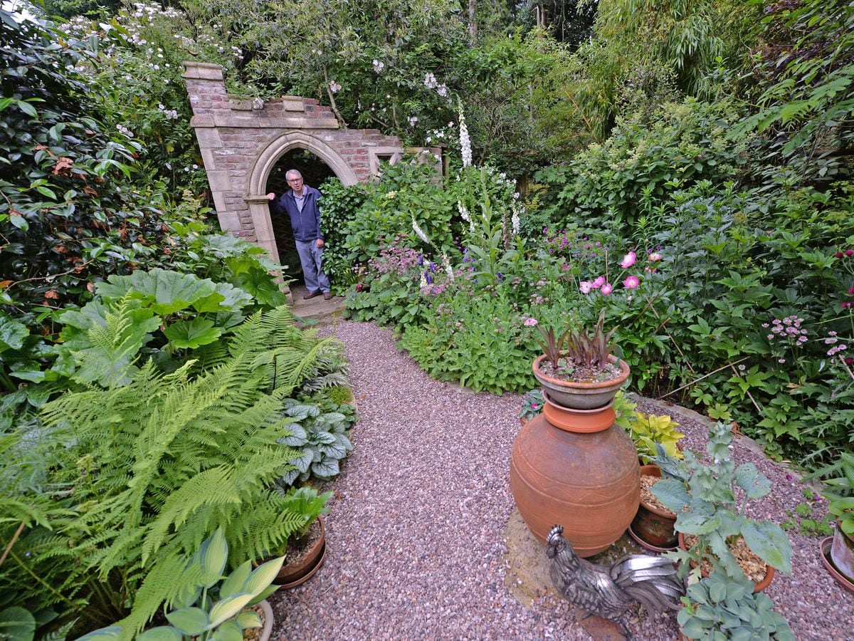 Brian Bailey in the folly, one of the unique parts of the garden