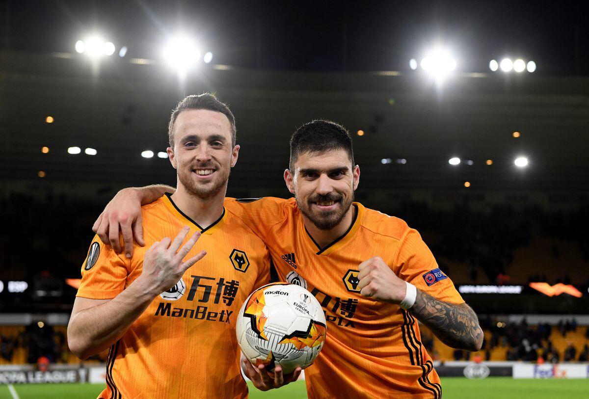 Diogo Jota of Wolverhampton Wanderers and Ruben Neves of Wolverhampton Wanderers celebrate at full time (AMA)
