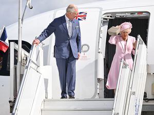 Charles and Camilla leaving the plane