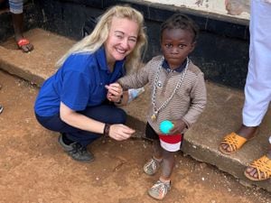 Sylvia with a young girl in Zambia  