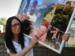 Dawn Bennett with photos of her son Shane Mayer who was murdered in Darlaston in 2019