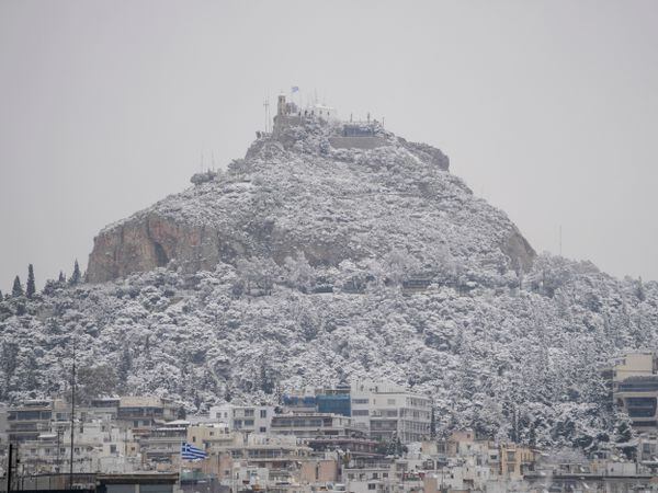 The city of Athens, including the Lycabettus Hill, is covered with snow