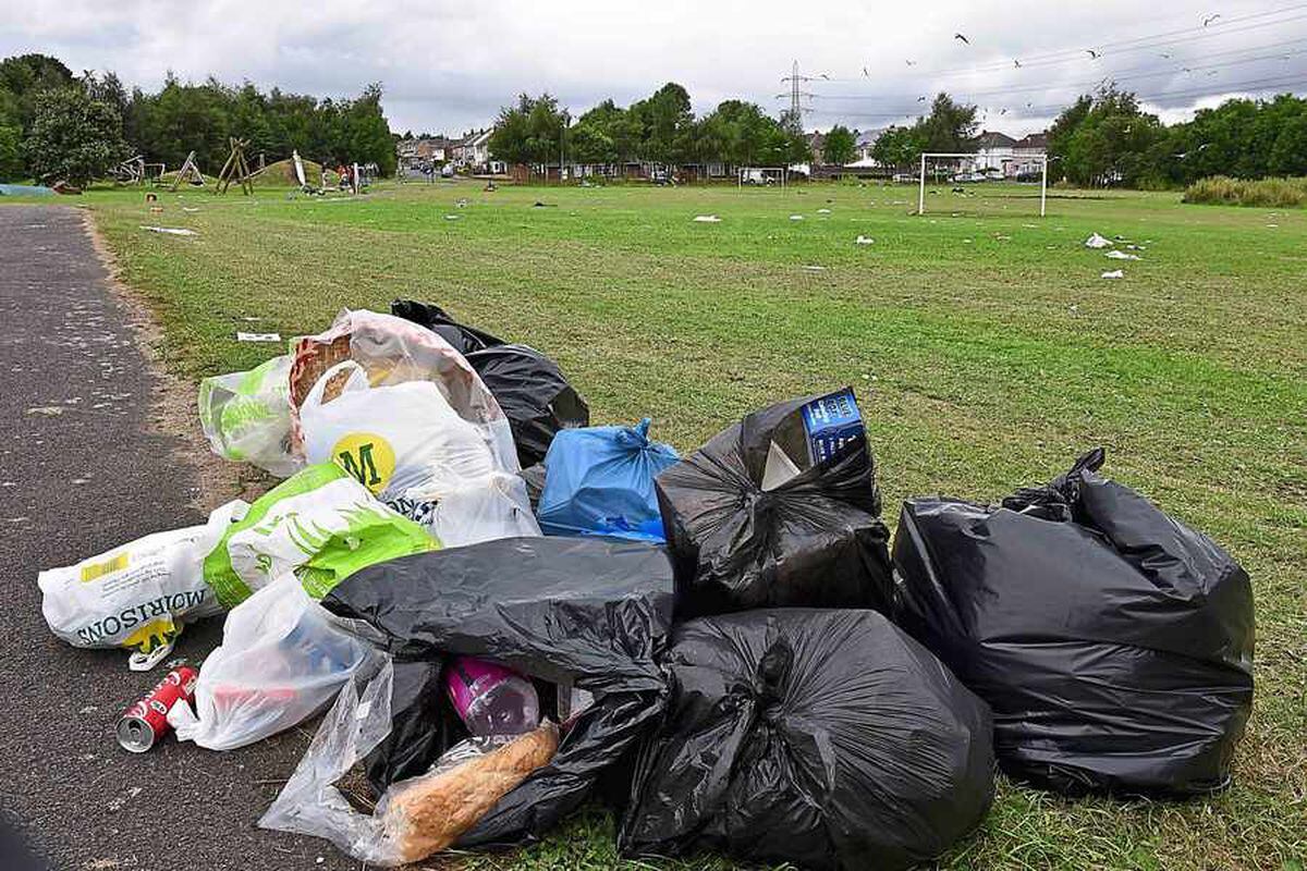 Black bin bags stuffed with waste have been left behind