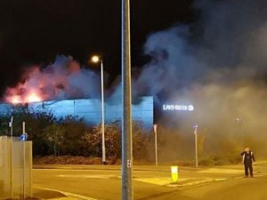 Smoke pours out of the Swansway Land Rover building in Stafford. Photo: @RoadTransportUK