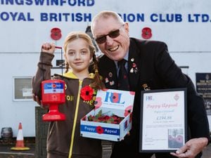 Poppy Cresswell, aged seven, with Bob Townsend poppy organiser of Kingswinford Royal British Legion