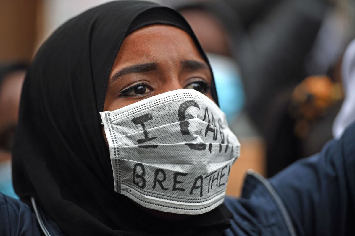 A protester wearing a mask during a Black Lives Matter protest rally at Centenary Square in Birmingham, in memory of George Floyd who was killed on May 25 while in police custody in the US city of Minneapolis