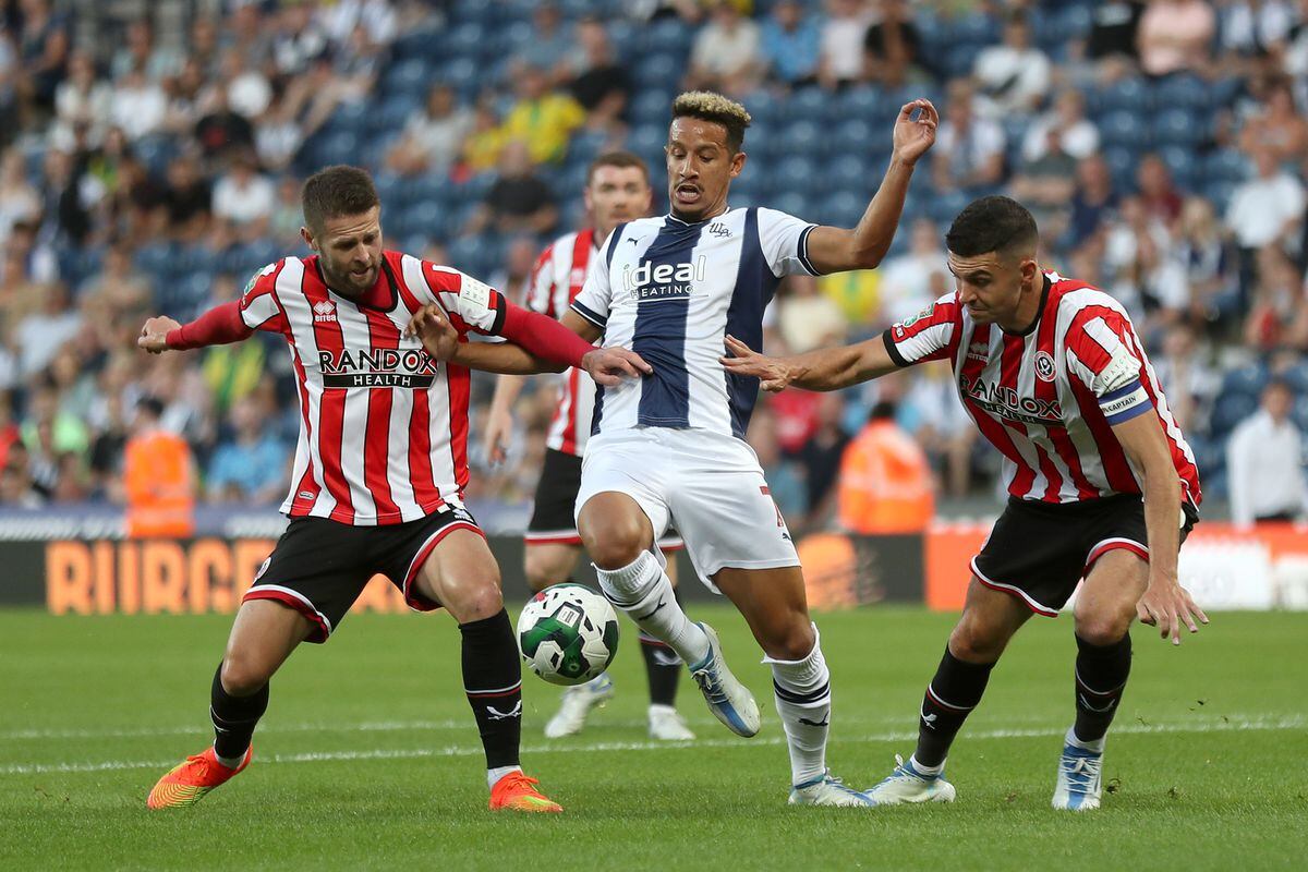 Oliver Norwood of Sheffield United, Callum Robinson of West Bromwich Albion and John Egan of Sheffield United during the Carabao Cup First Round match between West Bromwich Albion and Sheffield United at The Hawthorns on August 11, 2022 in West Bromwich, England. (Photo by Adam Fradgley/West Bromwich Albion FC via Getty Images).