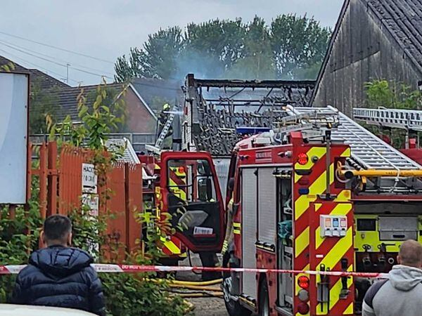 Fire crews at the scene of the blaze in Wharf Mews, Netherton. Photo: Ria Butcher